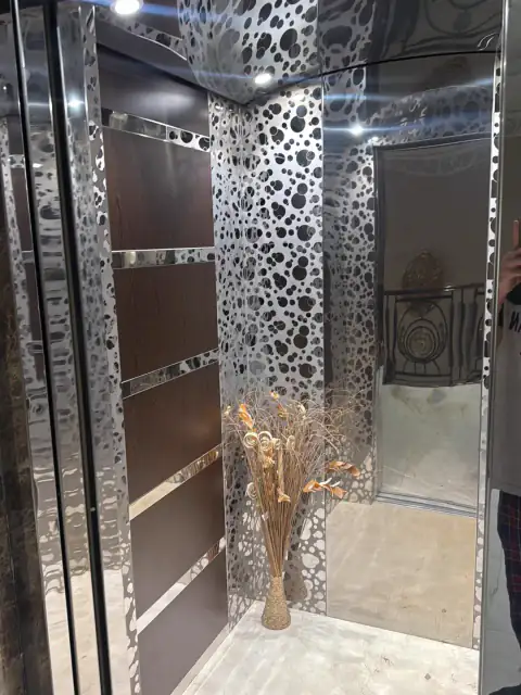 Marble-framed landing door with glass cabin