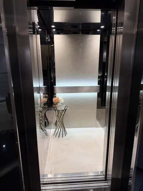 Cabin with LED lighting, flowers on a glass table