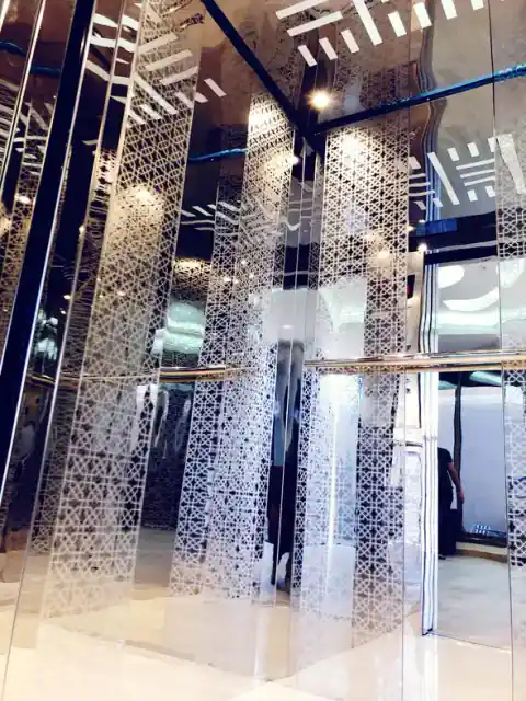 Cabin with etched mirror-glass pattern panels and lattice ceiling