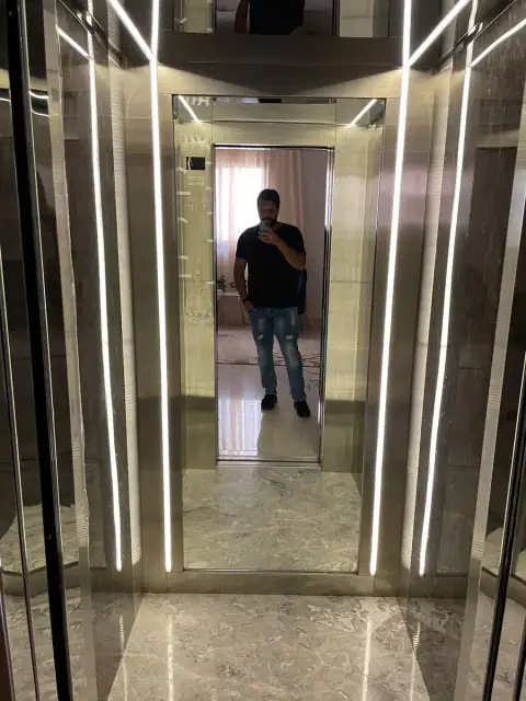 Cabin with LED strips, marble floor and mirror back wall