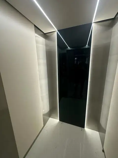 Cabin with black glass back panel and LED edge lighting
