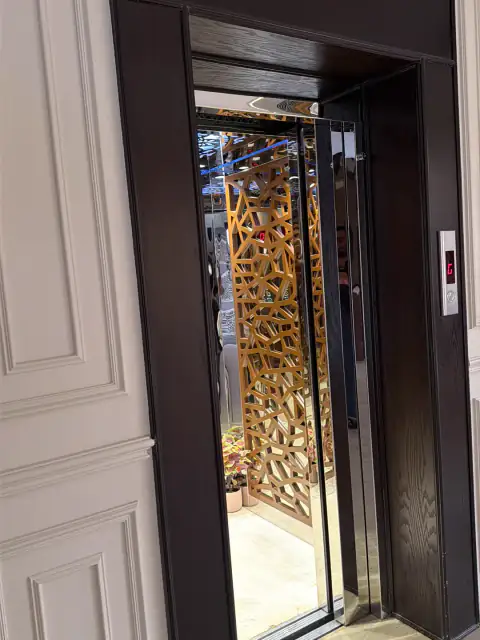 Cabin doors with carved gold panelling behind