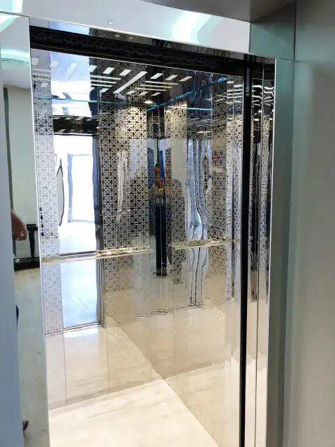 Etched-glass cabin seen from the landing