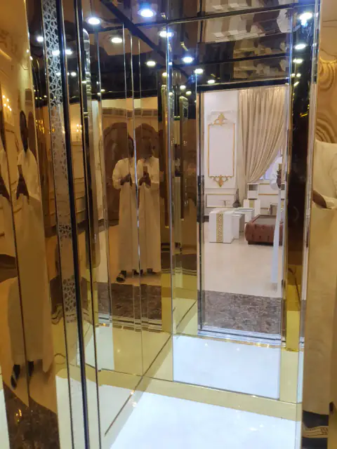 Gold-finish cabin with mirror walls