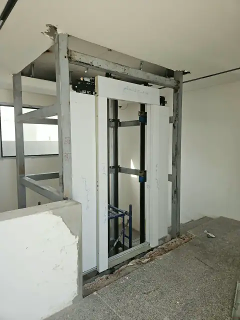 Home lift steel frame assembled in the stairwell, before cladding